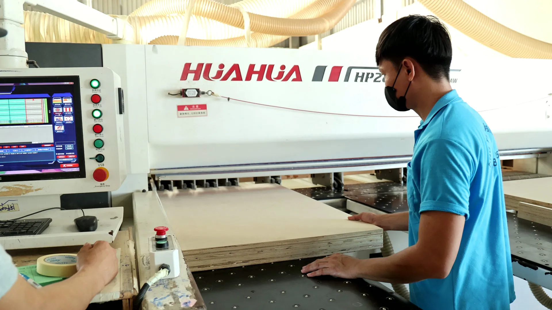 Plywood panels being cut to size